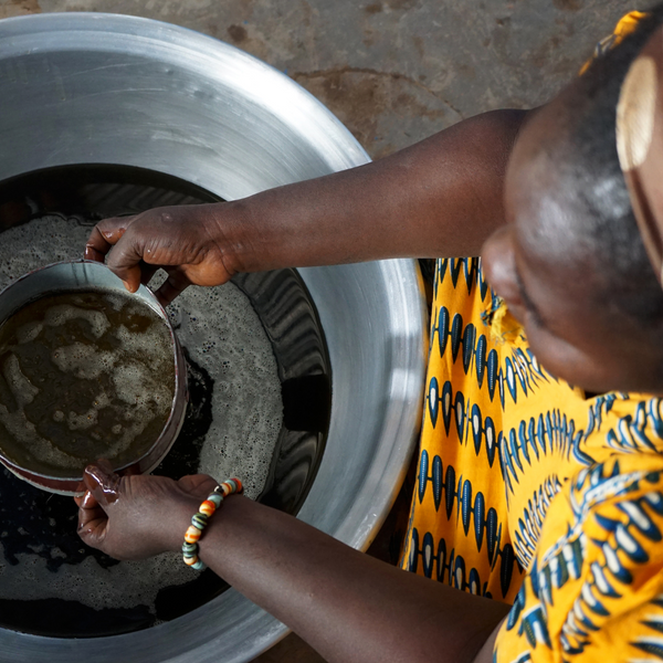 Raw unrefined Shea butter with a grainy texture before melting