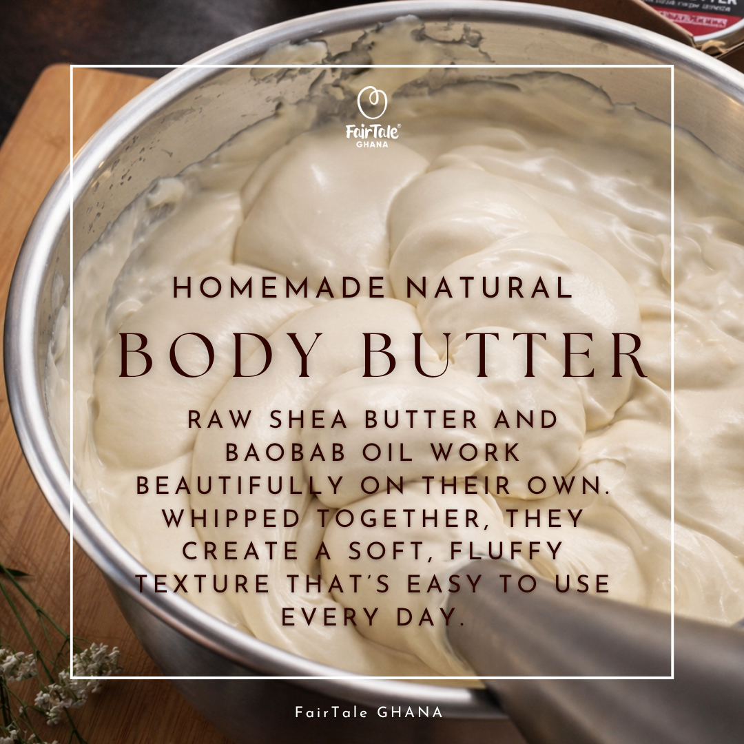 A close-up of whipped off-white body butter in a metal bowl, with overlaid text reading 'HOMEMADE NATURAL BODY BUTTER' and 'FAIRTALE GHANA.' The scene is styled like a kitchen or beauty preparation shot, with a wooden surface visible around the bowl.